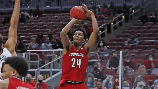Jae'Lyn Withers shoots against Virginia in the KFC Yum! Center on March 6
