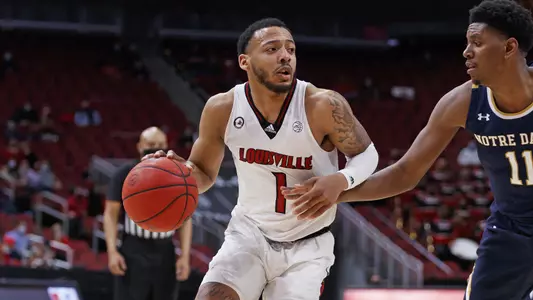 Carlik Jones handles the ball vs. Notre Dame in the KFC Yum! Center.