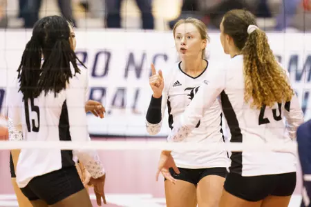 claire Chaussee celebrates at the net against San Diego