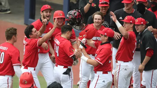 The Cardinals celebrate a Trey Leonard home run at Virginia.