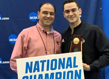 Nick and Arthur Albiero pose with National Championship banner