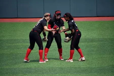 Celene Funke celebrates in center field.