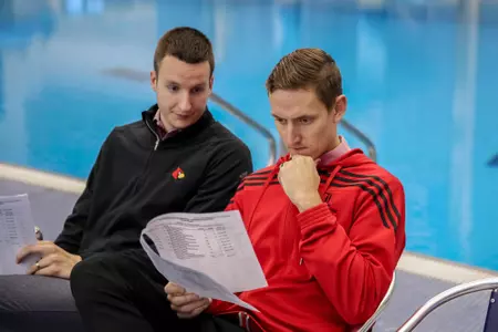 Kameron Chastain, Chris Lindauer checking heat sheets on deck