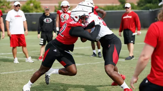 FB: Yasir Abdullah fights off a block