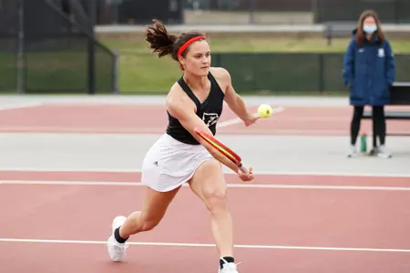 Dina Chaika returns the ball during singles action.