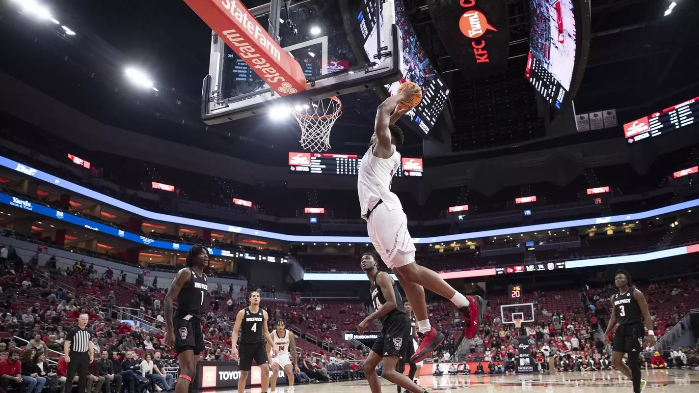 Sydney Curry dunks against NC State.