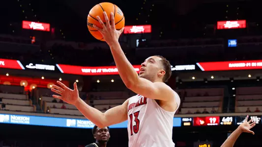 Jarrod West lays the ball up in the KFC Yum! Center.