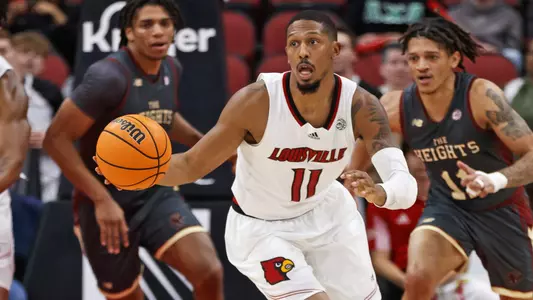 Mason Faulkner looks up the court against Boston College in the KFC Yum! Center on Jan. 19, 2022.