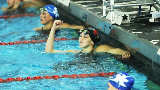 Gabi Albiero celebrates a win on the blocks