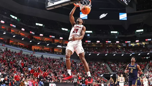 Jae'Lyn Withers dunks against Notre Dame in the KFC Yum! Center on Jan. 22, 2022.