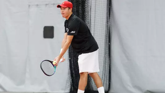 Tin Chen gets ready to serve vs. Dayton