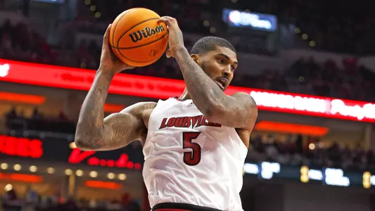 Malik Williams rebounds a shot against Notre Dame in KFC Yum! Center on Jan. 22, 2022.