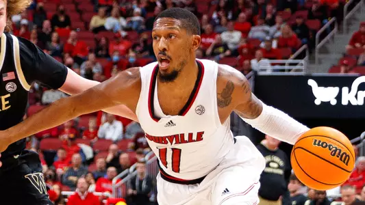 Mason Faulkner drives against Wake Forest in KFC Yum! Center on Dec. 29, 2021.