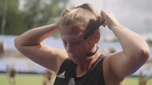 Julie Kouijzer puts on her face mask before taking the field