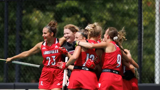 Field hockey celebrates a goal against Michigan