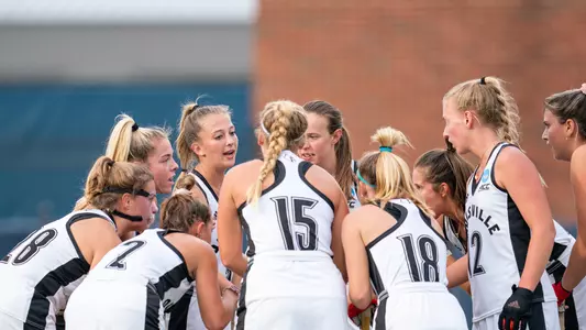 Louisville field hockey huddle at the NCAA tournament