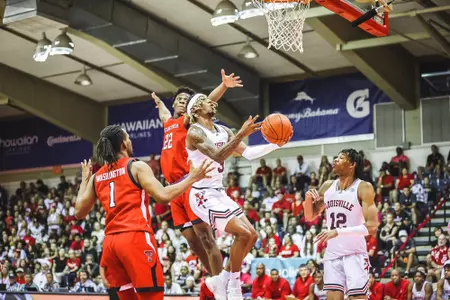 El Ellis drives to the basket against Texas Tech in the Maui Invitational.