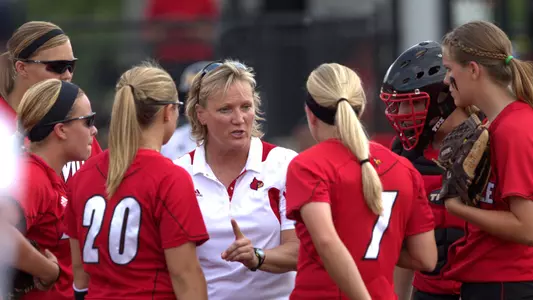 Former UofL Associatte Head Softball Coach Carol Bruggeman meets with the team prior to the 2011 NCAA game against Michigan