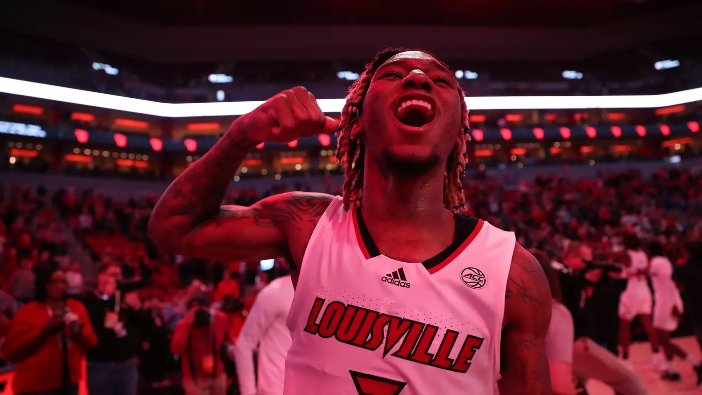 El Ellis celebrates after Louisville defeated Western Kentucky at the KFC Yum! Center.