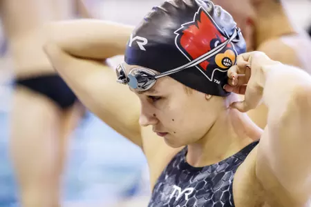 Abby Hay puts on her cap