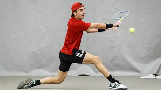 Etienne Donnet returns the ball against Purdue