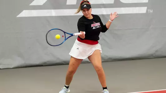 Tatiana Simova returns a serve against Miami (Ohio)