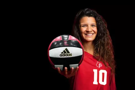 Raquel Lazaro poses in a Cardinals uniform