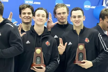 The 200 medley relay throw up their L's on the podium