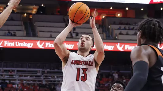 Jarrod West shoots against Miami in the KFC Yum! Center on Feb. 16.