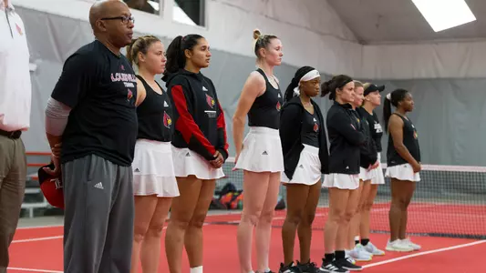 The University of Louisville women's tennis team during the National Anthem