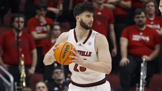Gabe Wiznitzer looks to pass in the KFC Yum! Center on Feb. 1, 2021.