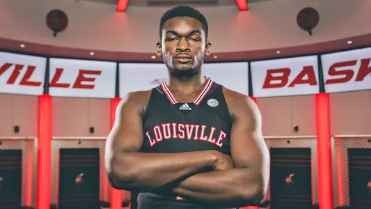 Brandon Huntey-Hatfield poses in the Cards' locker room in the KFC Yum! Center.