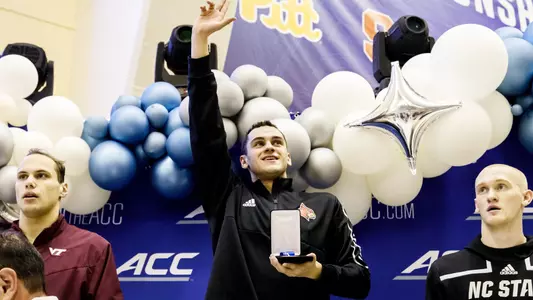 Nick Albiero throws up his L on award podium