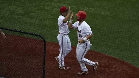 Christian Knapczyk and Jack Payton high five.