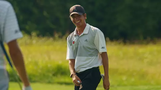 Nick Tenuta smiles after hitting in a put