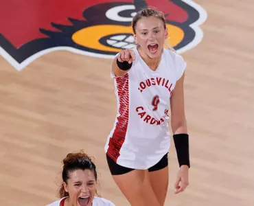 Claire Chaussee and Raquel Lazaro celebrate after a point during the game against San Diego.