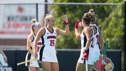 Emilia Kaczmarczyk and the field hockey team celebrate a goal against Fairfield