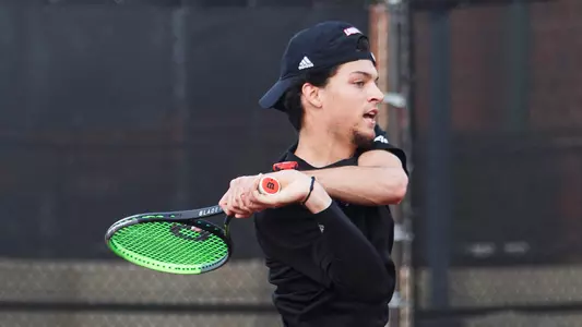 Matthew Fung returns the ball