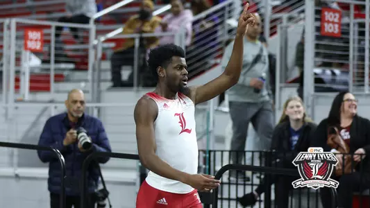 Cameron Miller celebrates after setting the 200m dash school record