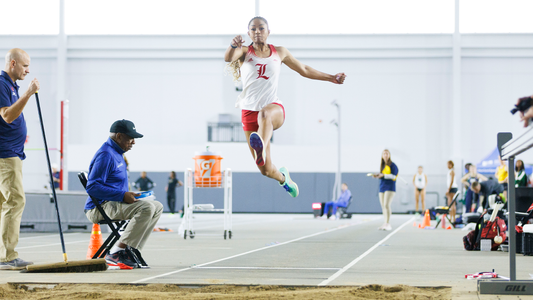 Synclair Savage breaks the long jump school record at the PNC Lenny Lyles Invitational