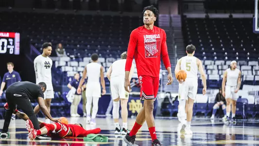 Emmanuel Okorafor warms up before Louisville's game at Notre Dame on Jan. 28, 2023.