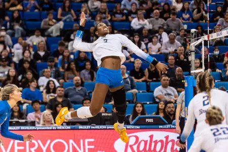 Charitie Luper takes a swing at the net