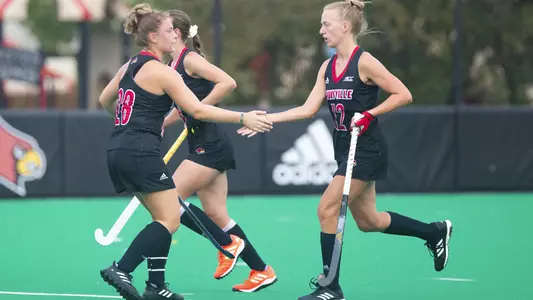 Julie Kouijzer and Mia Duchars celebrate a goal against Northeastern
