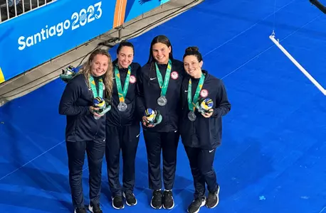 The silver medal relay team pose with their medals at the Pan Am Games