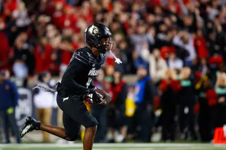 Maurice Turner scores a touchdown during the Louisville vs Virginia Football Game