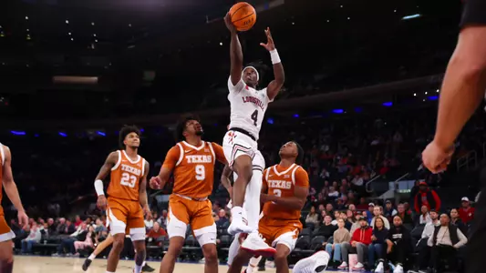 Ty-Laur Johnson drives to the basket against Texas in the Empire Classic at Madison Square Garden.