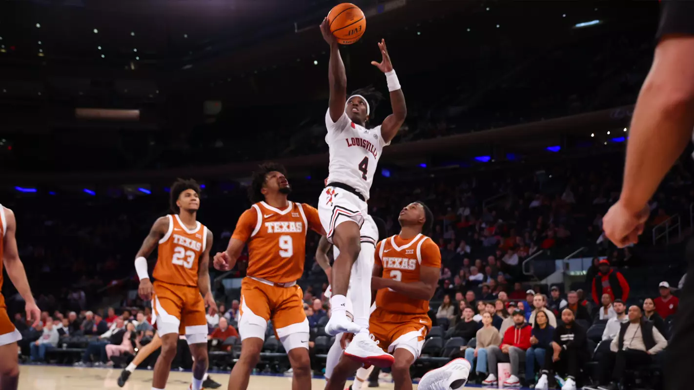 Ty-Laur Johnson drives to the basket against Texas in the Empire Classic at Madison Square Garden.