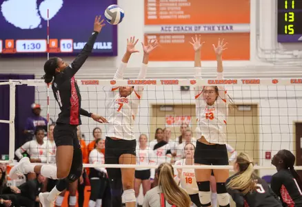 Charitie Luper hits against the Clemson block