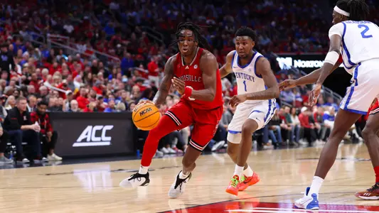 Mike James drives the ball against Kentucky at the KFC Yum! Center on December 21, 2023.