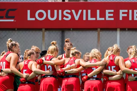 Louisville field hockey team huddle prior to the game against BellarmineLouisville field hockey team huddle prior to the game against Bellarmine